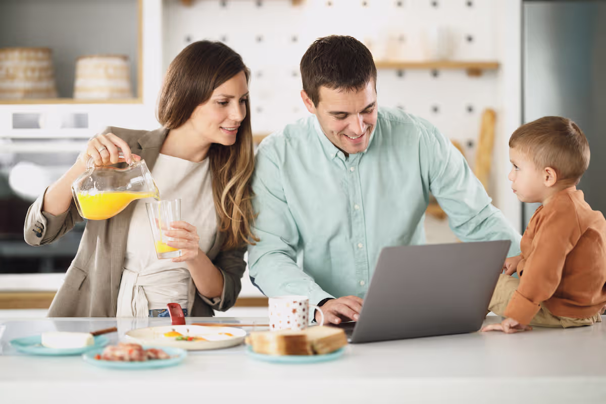 Canadian family reviewing their finances together at the kitchen table